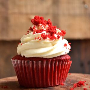 white and red cupcake with white icing on top